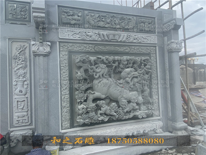 双狮浮雕壁堵石